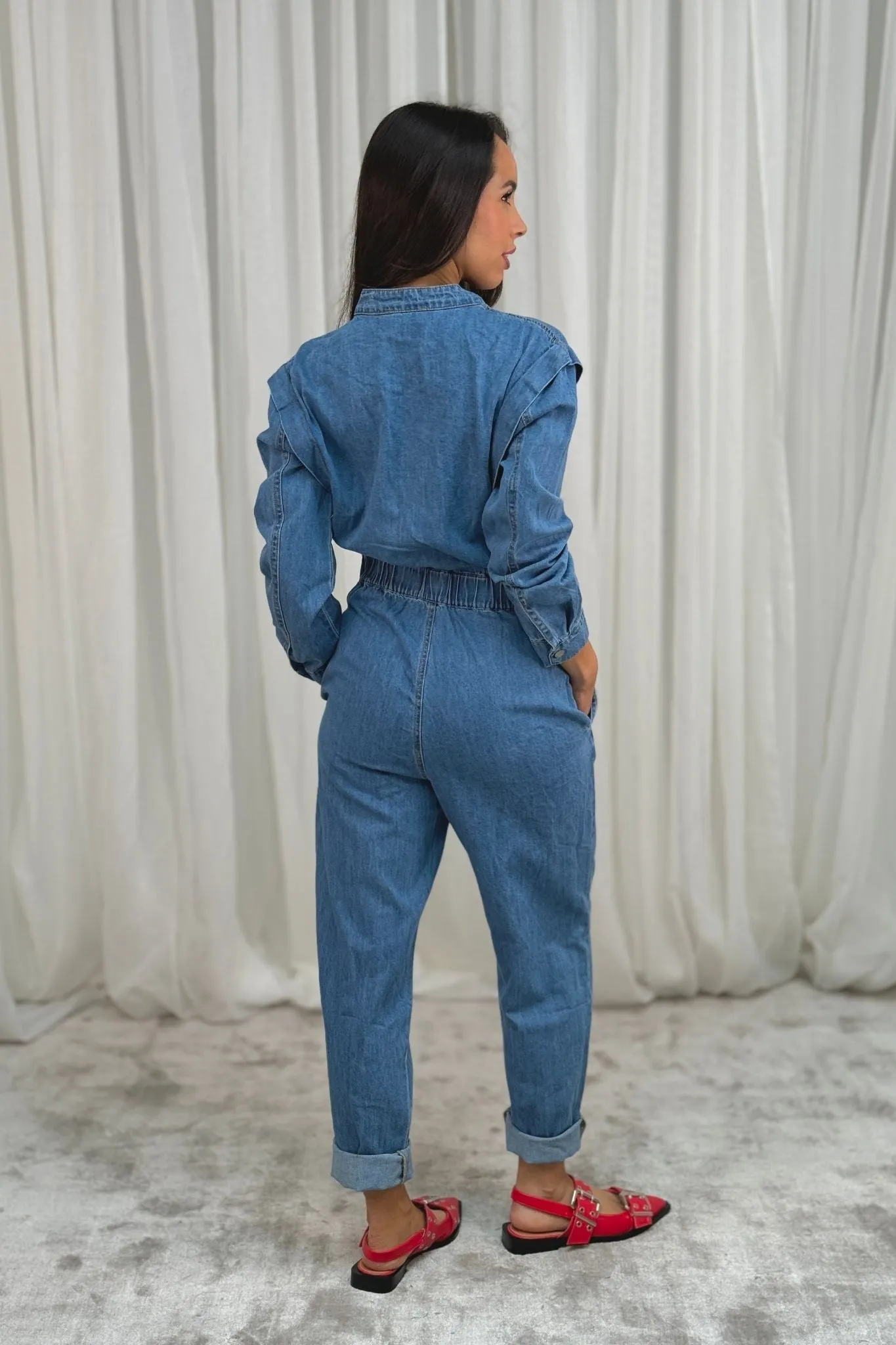 Cora Long Sleeve Jumpsuit In Mid Wash